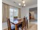 Well-lit dining room with wooden table and chairs, offering a comfortable dining experience at 102 E Thompson St, Lebanon, IN 46052