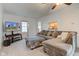 Comfortable living area with neutral tones, soft carpet, and views into the kitchen at 102 E Thompson St, Lebanon, IN 46052