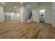 Finished basement with open floor plan, modern lighting, and access to bathroom and stairs at 1026 St Peter St, Indianapolis, IN 46203