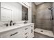 Elegant bathroom featuring a dual sink vanity with white marble counters and a glass-enclosed shower at 1026 St Peter St, Indianapolis, IN 46203