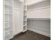 Walk-in closet with built-in shelving and ample storage space, ready for organization at 1026 St Peter St, Indianapolis, IN 46203