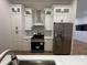Bright kitchen with stainless steel appliances, a gas range, and white marble backsplash at 1026 St Peter St, Indianapolis, IN 46203