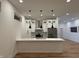 Contemporary kitchen with island, pendant lighting, stainless steel appliances, and custom cabinetry at 1026 St Peter St, Indianapolis, IN 46203