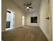 Main bedroom with carpet, ceiling fan, and ensuite bathroom at 1026 St Peter St, Indianapolis, IN 46203