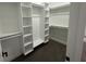 Walk-in closet featuring custom built-in shelving and ample storage space for an organized wardrobe at 1026 St Peter St, Indianapolis, IN 46203