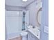 Updated bathroom with a shower/tub combo, vanity, and a decorative mirror, perfect for relaxation at 10321 Starview Dr, Indianapolis, IN 46229