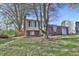 Charming front exterior of a split level home featuring a brick facade and landscaped yard at 10321 Starview Dr, Indianapolis, IN 46229