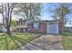 Charming front exterior of a split level home featuring a brick facade and attached garage at 10321 Starview Dr, Indianapolis, IN 46229