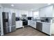 Modern kitchen with stainless steel appliances and white cabinets at 10321 Starview Dr, Indianapolis, IN 46229