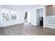 Sunlit living room featuring hardwood floors, staircase, and front door at 10321 Starview Dr, Indianapolis, IN 46229