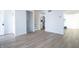 Open-concept living room with hardwood floors and staircase at 10321 Starview Dr, Indianapolis, IN 46229