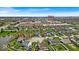 Residential area aerial view with multiple houses, a small pond, and Regal Shiloh Crossing, Target and Best Buy at 10407 Stillwell Ct, Avon, IN 46123
