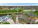 Aerial view shows property with pond, mature trees and landscaping plus neighboring homes at 10407 Stillwell Ct, Avon, IN 46123