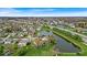Scenic aerial view of a neighborhood with a tranquil pond and easy access to the highway at 10407 Stillwell Ct, Avon, IN 46123