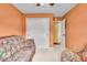 Bedroom with a floral patterned sofa and closet doors at 10407 Stillwell Ct, Avon, IN 46123