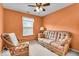 Cozy bedroom furnished with rattan furniture and a window offering natural light at 10407 Stillwell Ct, Avon, IN 46123