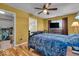 Bedroom features a ceiling fan, closet access, and natural light from the window at 10407 Stillwell Ct, Avon, IN 46123