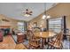 Cozy dining area with a fireplace and views to the backyard at 10407 Stillwell Ct, Avon, IN 46123