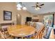 Open-concept dining area flowing into the living room, ideal for entertaining guests at 10407 Stillwell Ct, Avon, IN 46123