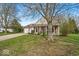 Quaint single-story home featuring a covered porch, two-car garage, and well-manicured front yard at 10407 Stillwell Ct, Avon, IN 46123