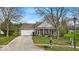Charming single-story home with an attached garage, well-kept lawn, and inviting front entrance at 10407 Stillwell Ct, Avon, IN 46123