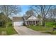 Charming single-story home with a well-manicured front yard and a double car garage at 10407 Stillwell Ct, Avon, IN 46123
