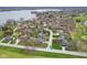 Picturesque aerial view of a neighborhood with waterfront properties, mature trees, and beautiful landscaping near a golf course at 108 Wesley Cir, Noblesville, IN 46062