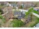 Aerial view of backyard patio with mature trees and landscaping of home near golf course at 108 Wesley Cir, Noblesville, IN 46062