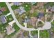 Aerial view of home showcasing a spacious backyard with mature trees, surrounded by well-maintained lawns in a peaceful neighborhood at 108 Wesley Cir, Noblesville, IN 46062