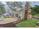 Beautiful backyard with patio, outdoor fireplace, and lush greenery at 108 Wesley Cir, Noblesville, IN 46062