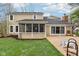 Spacious backyard with screened porch, patio, and well-maintained lawn at 108 Wesley Cir, Noblesville, IN 46062