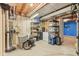 Basement storage area with shelving, storage containers, and laminate floor at 108 Wesley Cir, Noblesville, IN 46062