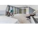 Large bedroom featuring carpeted floors, gray walls, ample space, and storage closet at 108 Wesley Cir, Noblesville, IN 46062