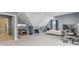 Spacious bedroom with sloped ceilings, TV, and a comfortable setup with a keyboard and workspace at 108 Wesley Cir, Noblesville, IN 46062