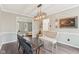 Bright dining room with a view into a bedroom, lovely decor, and neutral, modern tones at 108 Wesley Cir, Noblesville, IN 46062
