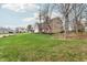 Spacious front yard view of a brick and siding home in a quiet neighborhood at 108 Wesley Cir, Noblesville, IN 46062