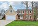 Charming brick and siding home with a well-manicured lawn and attached two car garage at 108 Wesley Cir, Noblesville, IN 46062