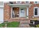 Cozy front porch with brick flooring, seating, and charming decor, perfect for relaxing outdoors at 108 Wesley Cir, Noblesville, IN 46062