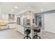 Bright and spacious kitchen with white cabinets, stainless appliances, and a large center island at 108 Wesley Cir, Noblesville, IN 46062