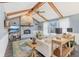 Bright living room featuring a vaulted ceiling, exposed beams, and a painted brick fireplace at 108 Wesley Cir, Noblesville, IN 46062