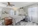 Inviting main bedroom with hardwood floors, soft colors, a ceiling fan, and two sunny windows at 108 Wesley Cir, Noblesville, IN 46062