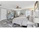 A spacious main bedroom features hardwood floors, a decorative ceiling fan, and abundant natural light at 108 Wesley Cir, Noblesville, IN 46062