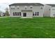 Lush backyard featuring green grass and exterior of the home at 11188 Giddings Pl, Noblesville, IN 46060