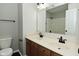 Bathroom with double sink vanity with new fixtures, tile floors and a toilet to the side at 11188 Giddings Pl, Noblesville, IN 46060