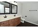 Bathroom featuring double sinks, a neutral color scheme, and hardwood floors at 11188 Giddings Pl, Noblesville, IN 46060