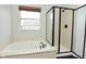 Bathroom with soaking tub and shower; natural light, neutral colors and updated shower at 11188 Giddings Pl, Noblesville, IN 46060