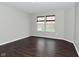 Cozy bedroom featuring gleaming hardwood floors and a window with custom blinds at 11188 Giddings Pl, Noblesville, IN 46060
