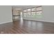 Open-concept living room with hardwood floors connecting to dining area at 11188 Giddings Pl, Noblesville, IN 46060