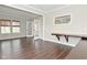 Bright living room with hardwood floors, built-in desk and large windows at 11188 Giddings Pl, Noblesville, IN 46060