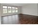 Spacious living room with hardwood floors and many large windows at 11188 Giddings Pl, Noblesville, IN 46060